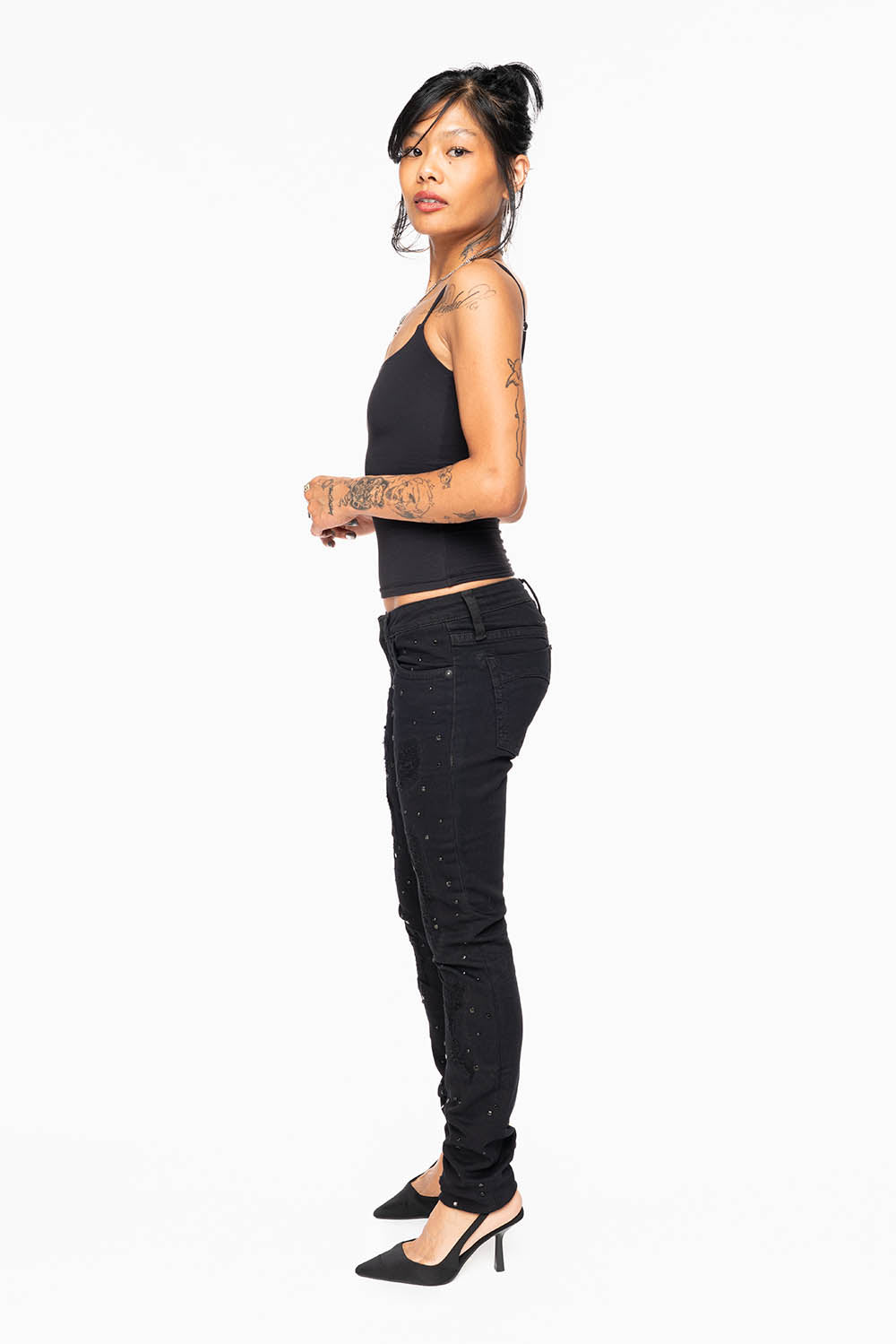 MARILYN WOMENS SKINNY JEANS IN REPAIRED PURE BLACK WITH TONAL WINGS EMBELLISHED WITH CRYSTALS & STUDS